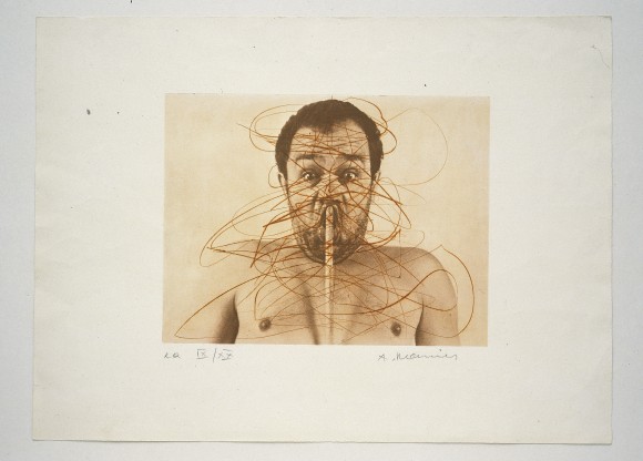 A self-portrait of the artist Arnulf Rainer. The portrait is overpainted. 