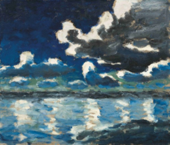 A dark blue sky with turbulent clouds is reflected on the surface of the sea, with a dark strip of coastline in the background.