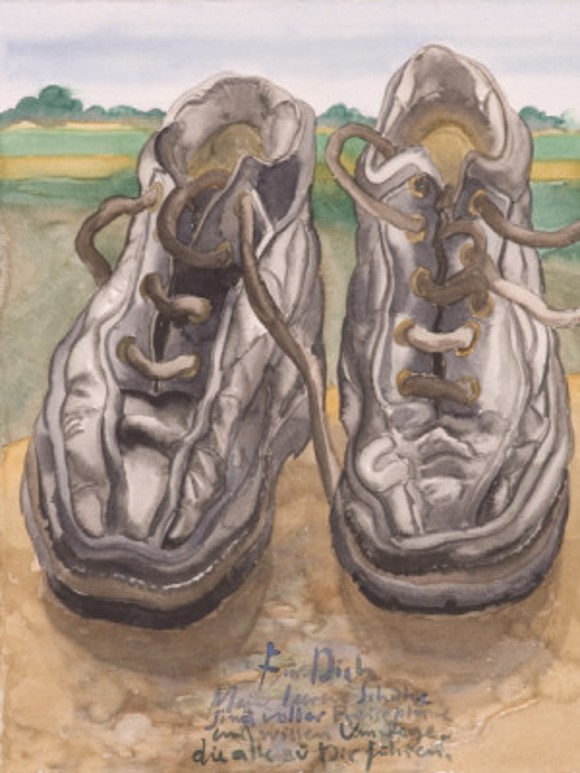 A pair of brown leather shoes stand on the ground. In the background, a green landscape is visible. In front of the shoes on the ground, there is some handwritten text in the middle.  